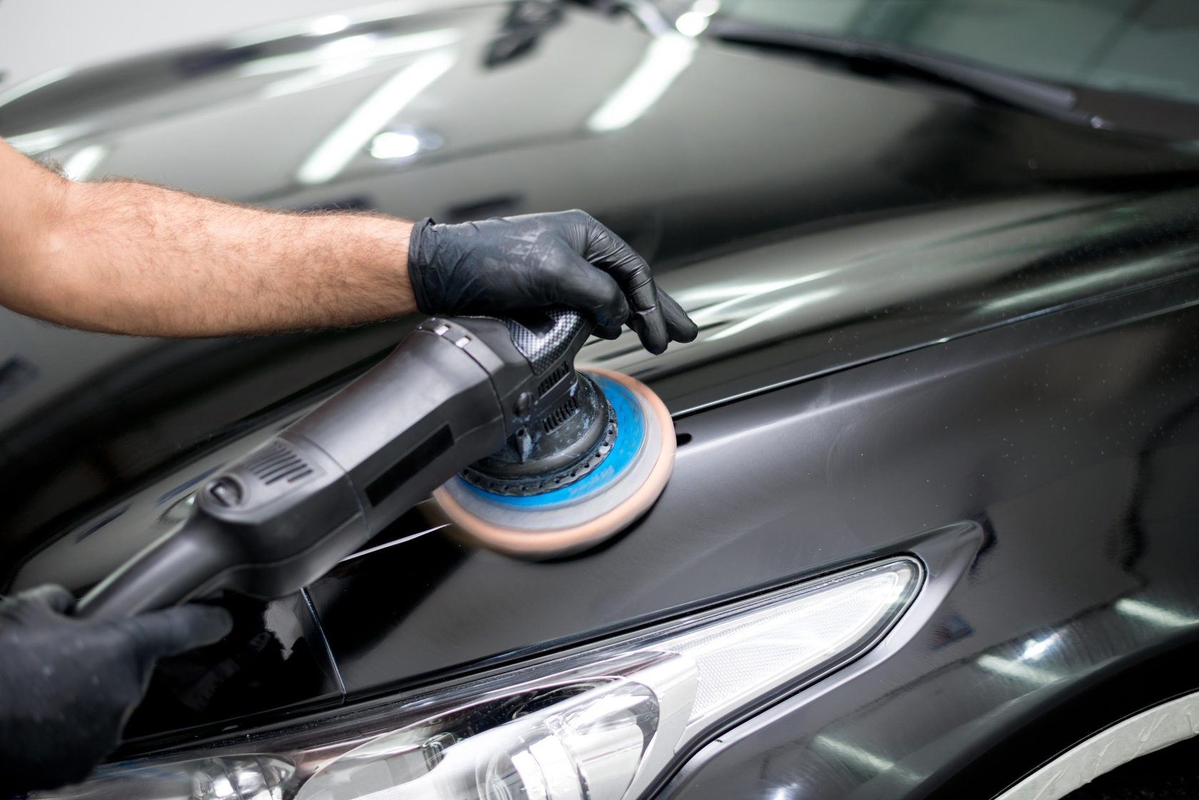 Professional automotive detailing with polish equipment