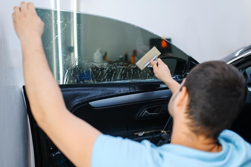 Removing bubbles from interior tint application